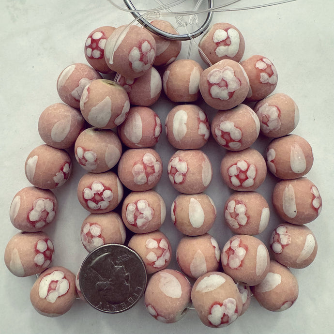 pale peach pink off white, floral motif ceramic, 18mm round, 13 piece strand, sold per strand