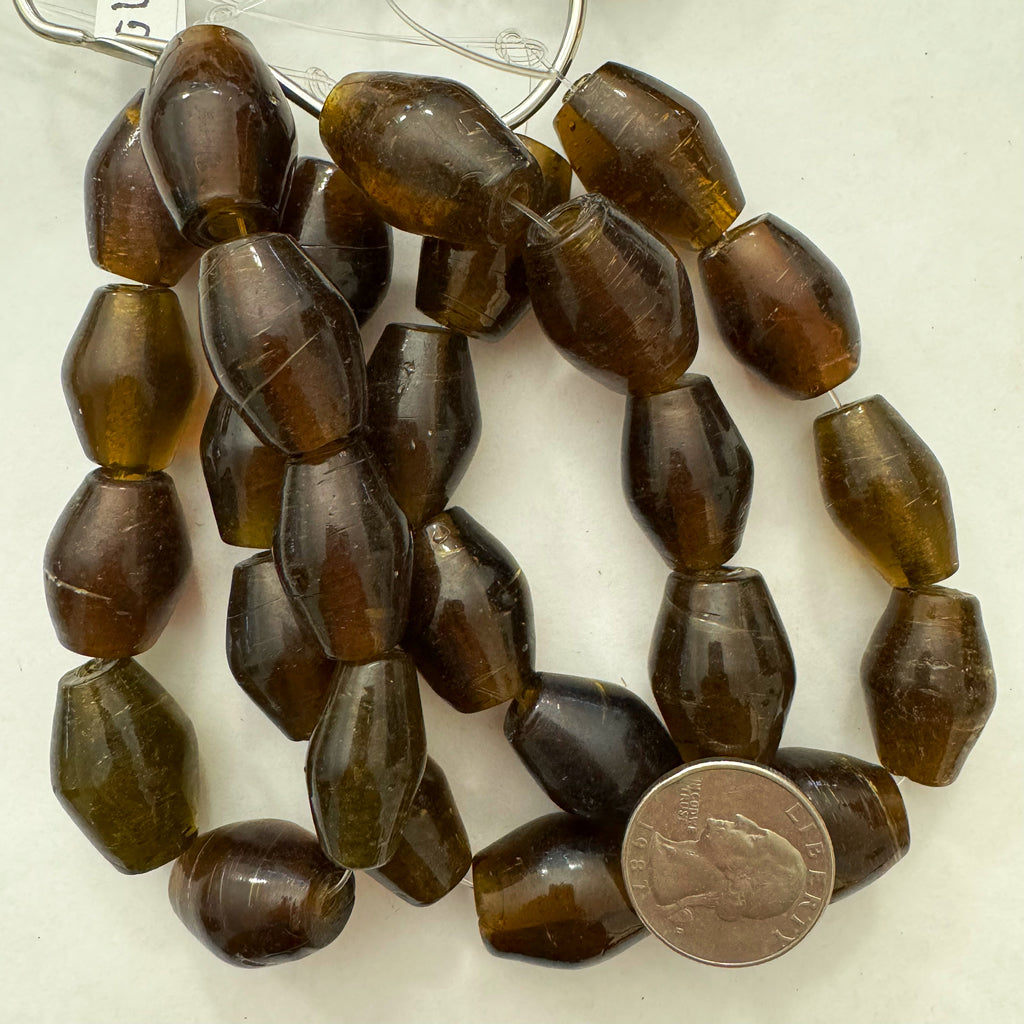 glass, dark golden amber, 23x17mm bowed tube, 9 piece strand, sold per strand