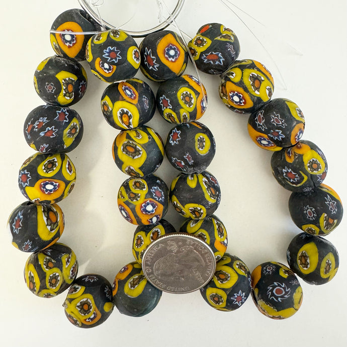 millefiori motif glass, matte black yellow orange multi, 18mm mixed size round, 13 piece strand, sold per strand