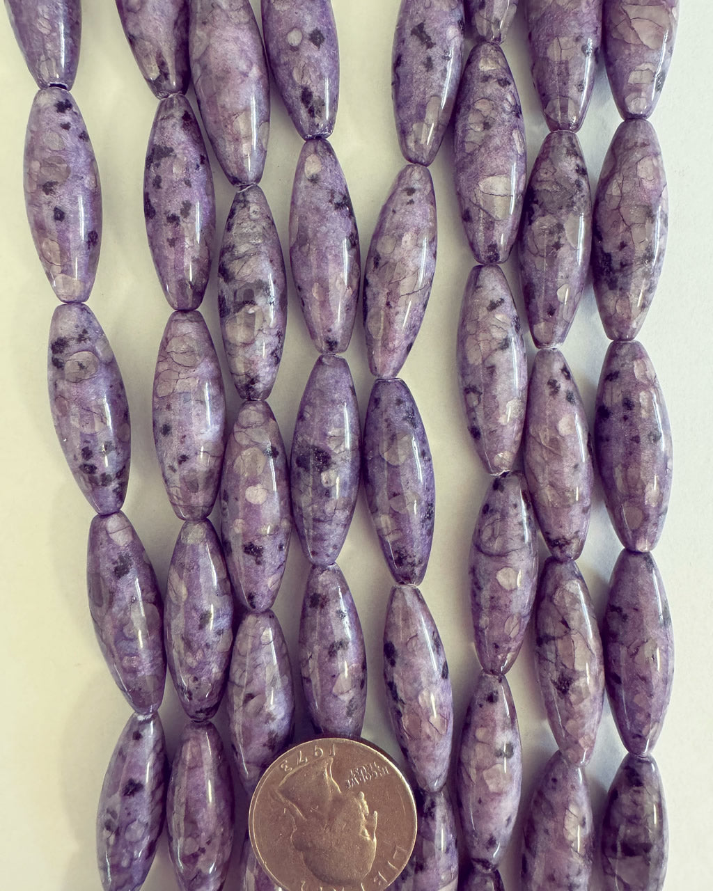 color enhanced purple kiwi quartz, 31x10mm bowed tube, 15