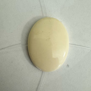 resin,  off white, 39x31x7mm puff oval domed one side flat one side, 2 direction drilled, 6pc strand, sold per strand