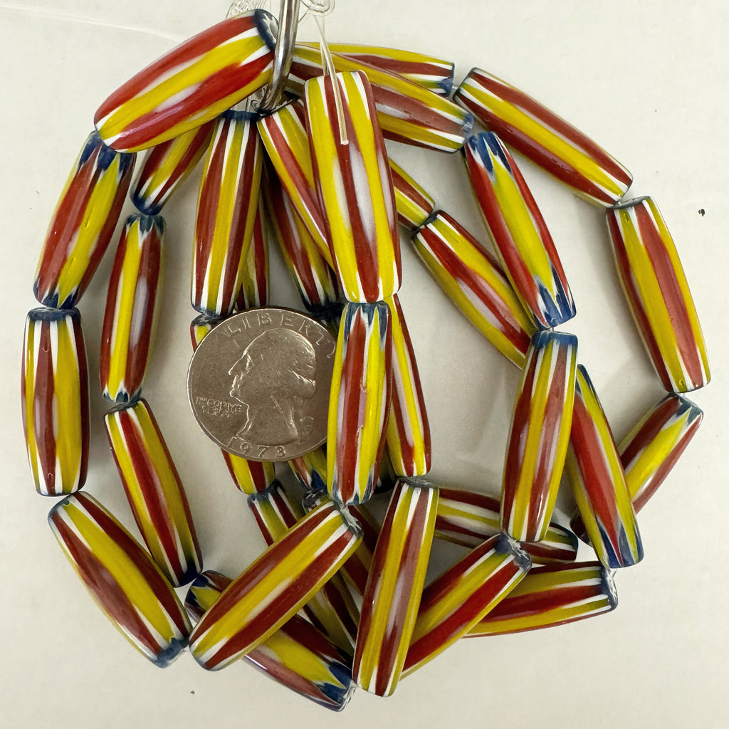 chevron motif glass, yellow red blue white, 30x10mm mixed size bowed tube, 7 piece strand, sold per strand