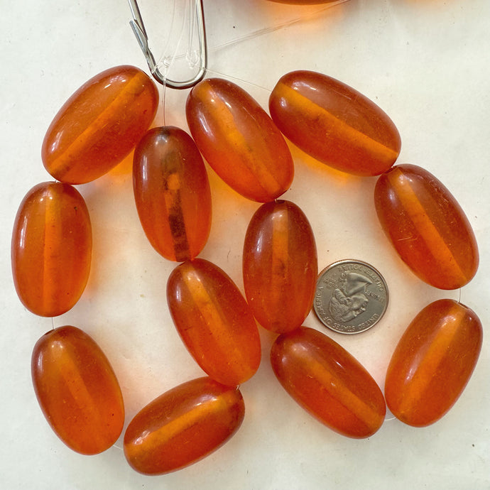 vintage look faux amber resin, translucent red orange 39x22mm bowed tube, 6pc strand, sold per strand