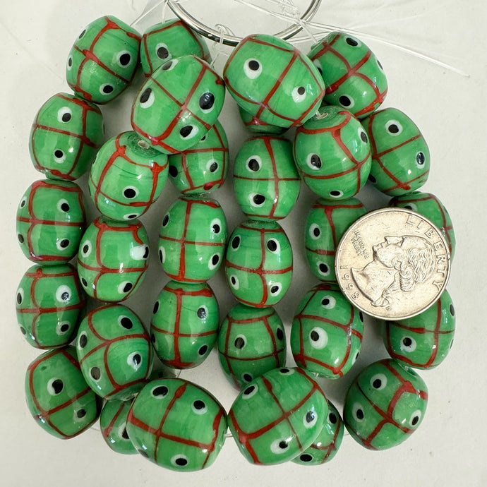 lines dots eyes motif glass, mint green red black white, 20x17mm barrel, 10 piece strand, sold per strand