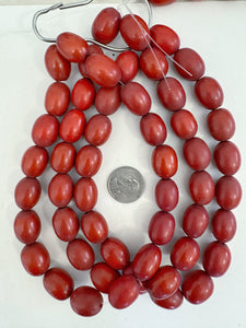 vintage look motif resin, pale dark red, 21x16mm tube barrel, 15" strand, sold per strand