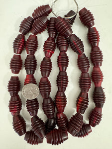 red horn, 29x19mm carved center ridges bicone barrel tube, 15" strand, sold per strand