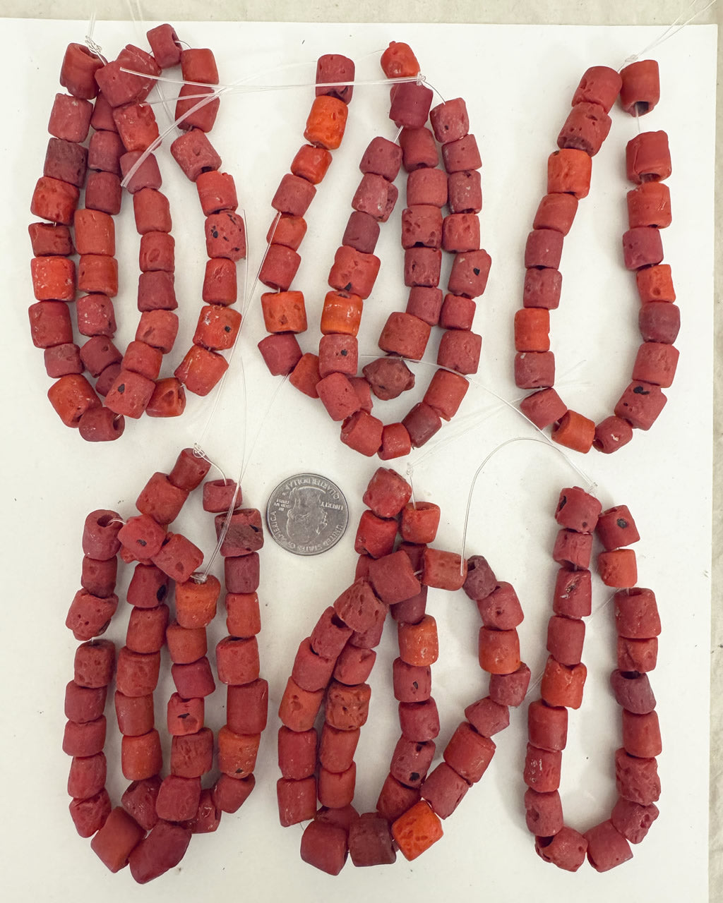 faux ancient coral look motif glass, matte pale red mix, 9-11mm barrel mix, 10 strand closeout lot