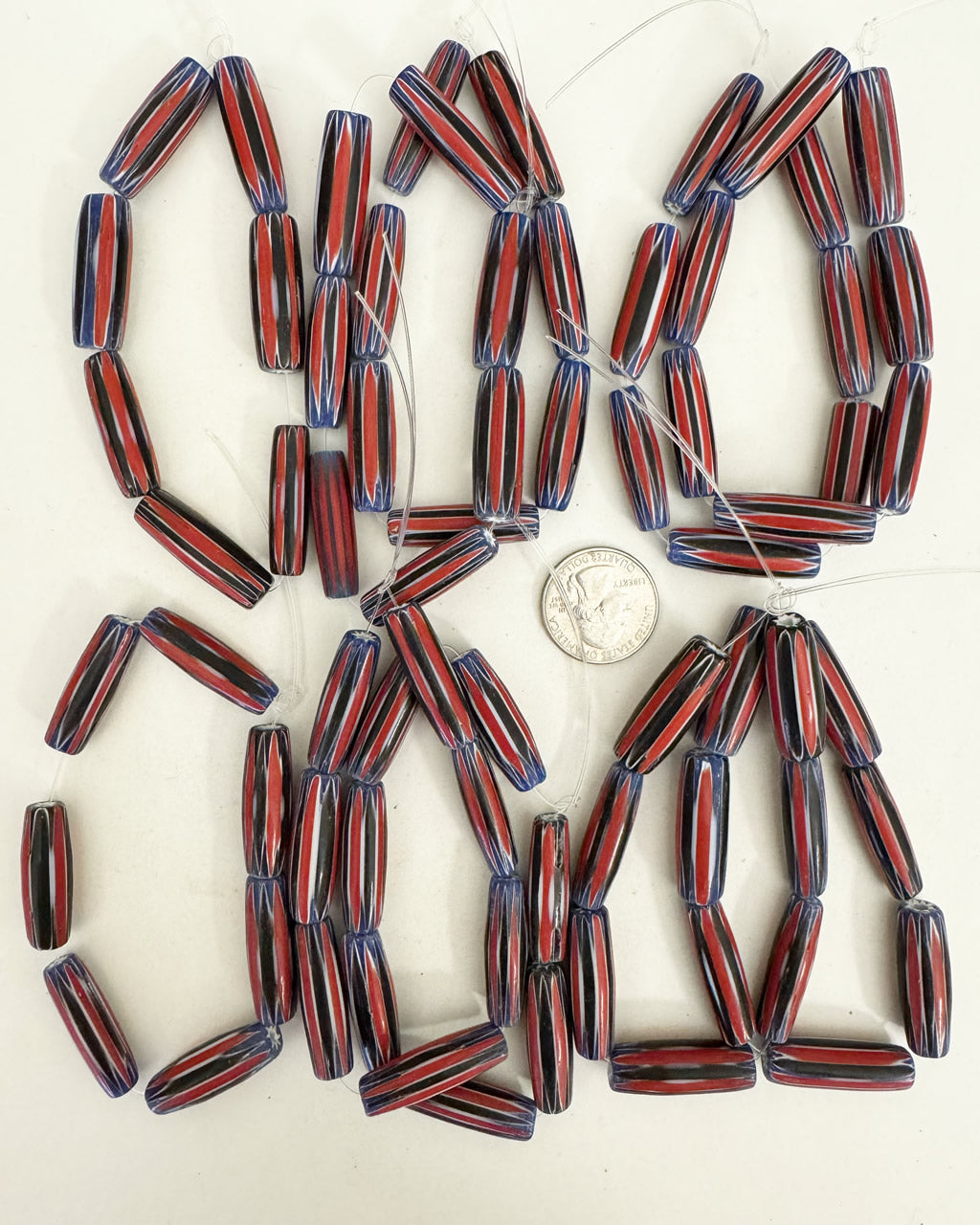 chevron motif glass, red white blue black, 30x10mm mixed size bowed tube, 10 strand closeout lot