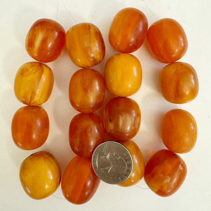 faux amber look resin, red orange white swirl, 27x23mm barrel, 8pc strand, sold per strand