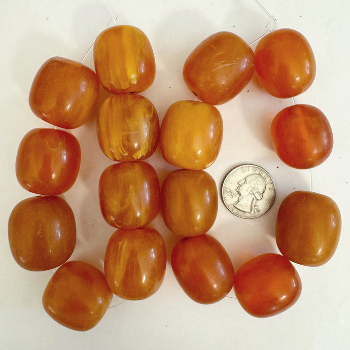 faux amber look resin, red orange white swirl, 27-29mm barrel, 8pc strand, sold per strand