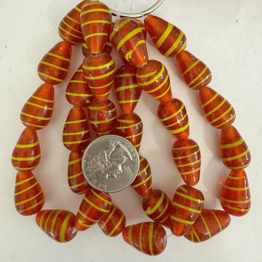 swirl motif glass, burnt orange yellow, 20x13mm pear, 11 piece strand, sold per strand