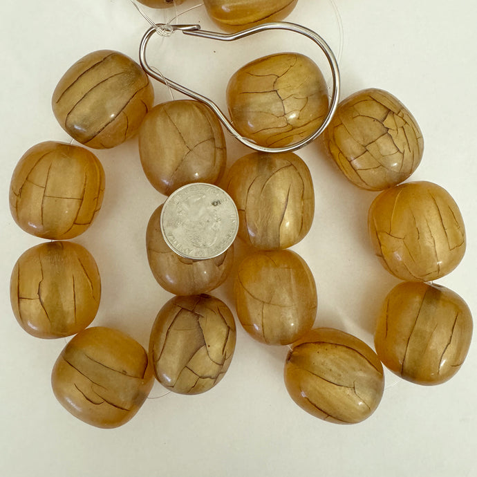 crackle motif resin, pearly dark yellow peach, 32x29mm barrel, 7pc strand, sold per strand