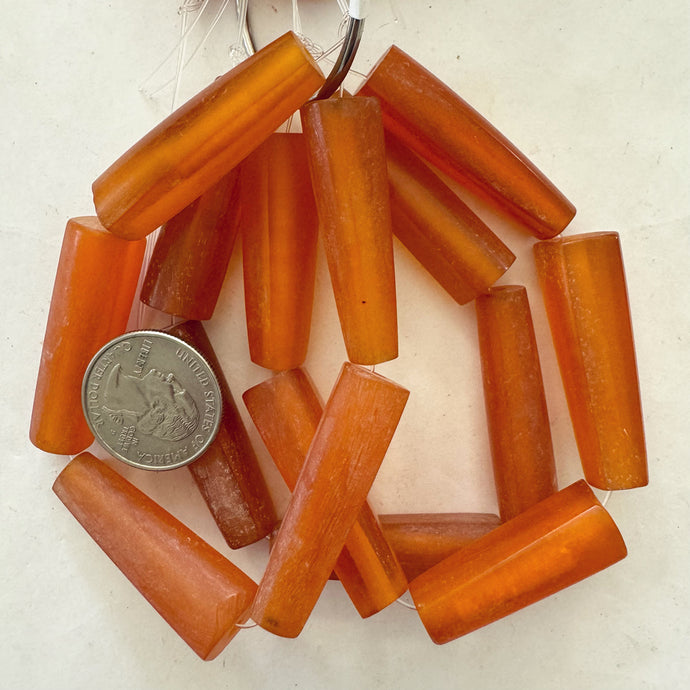 vintage look faux amber resin, translucent red orange 41x12x12mm 4 sided pointed tube, 5pc strand, sold per strand