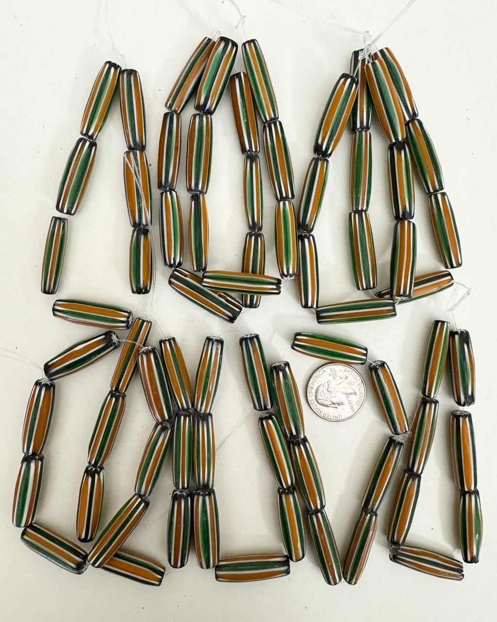 chevron motif glass, green orange white black, 30x10mm mixed size bowed tube, 10 strand closeout lot