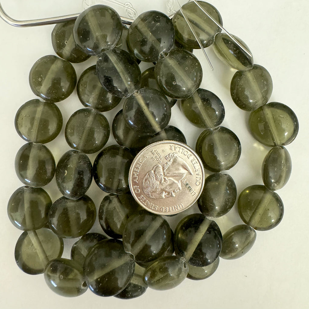 glass, translucent dark gray green, 16x16x8mm puff coin, 14 piece strand, sold per strand