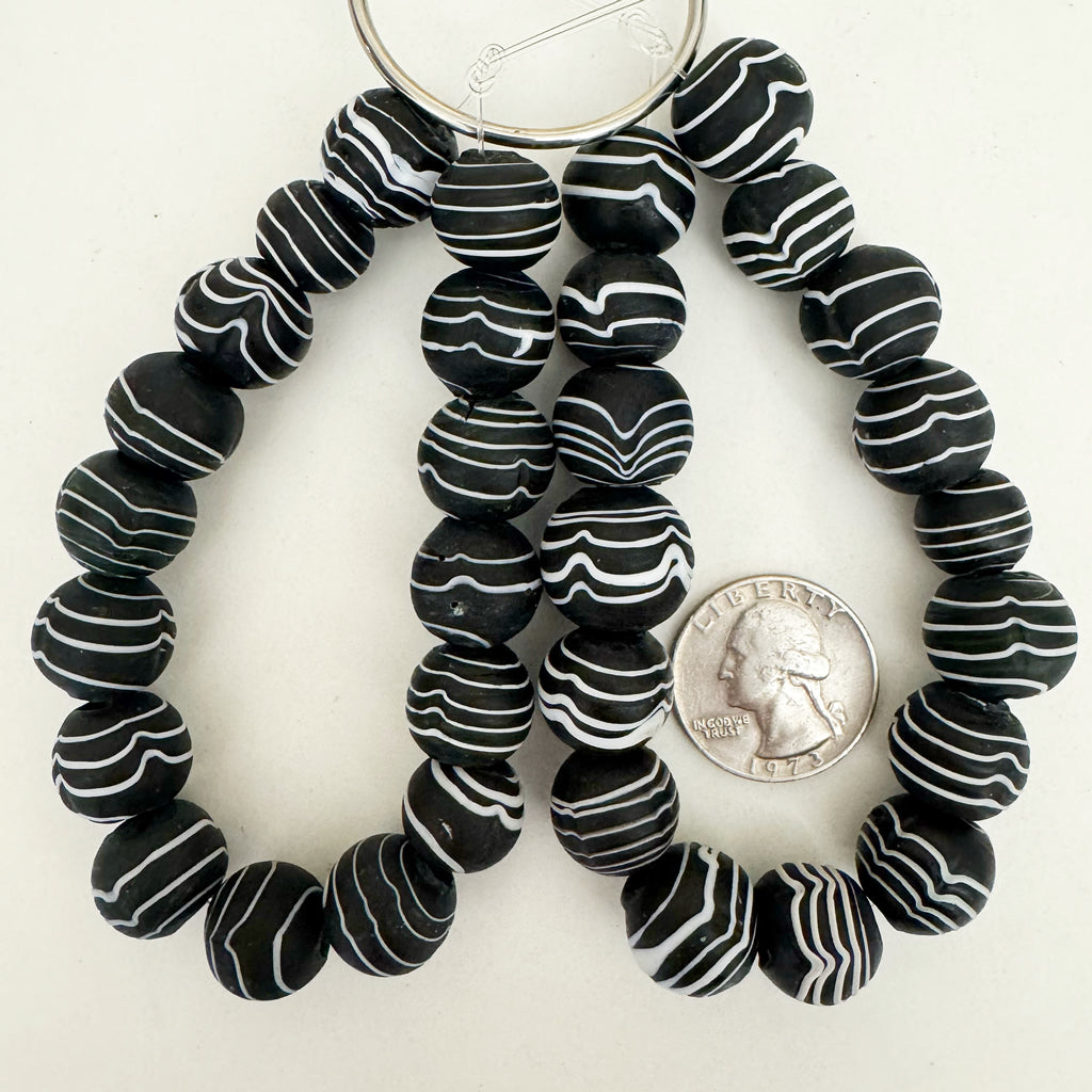 vintage look glass, matte finish, black and white, drawn stripe motif, 15mm irregular round mix,  sold per 16pc strand