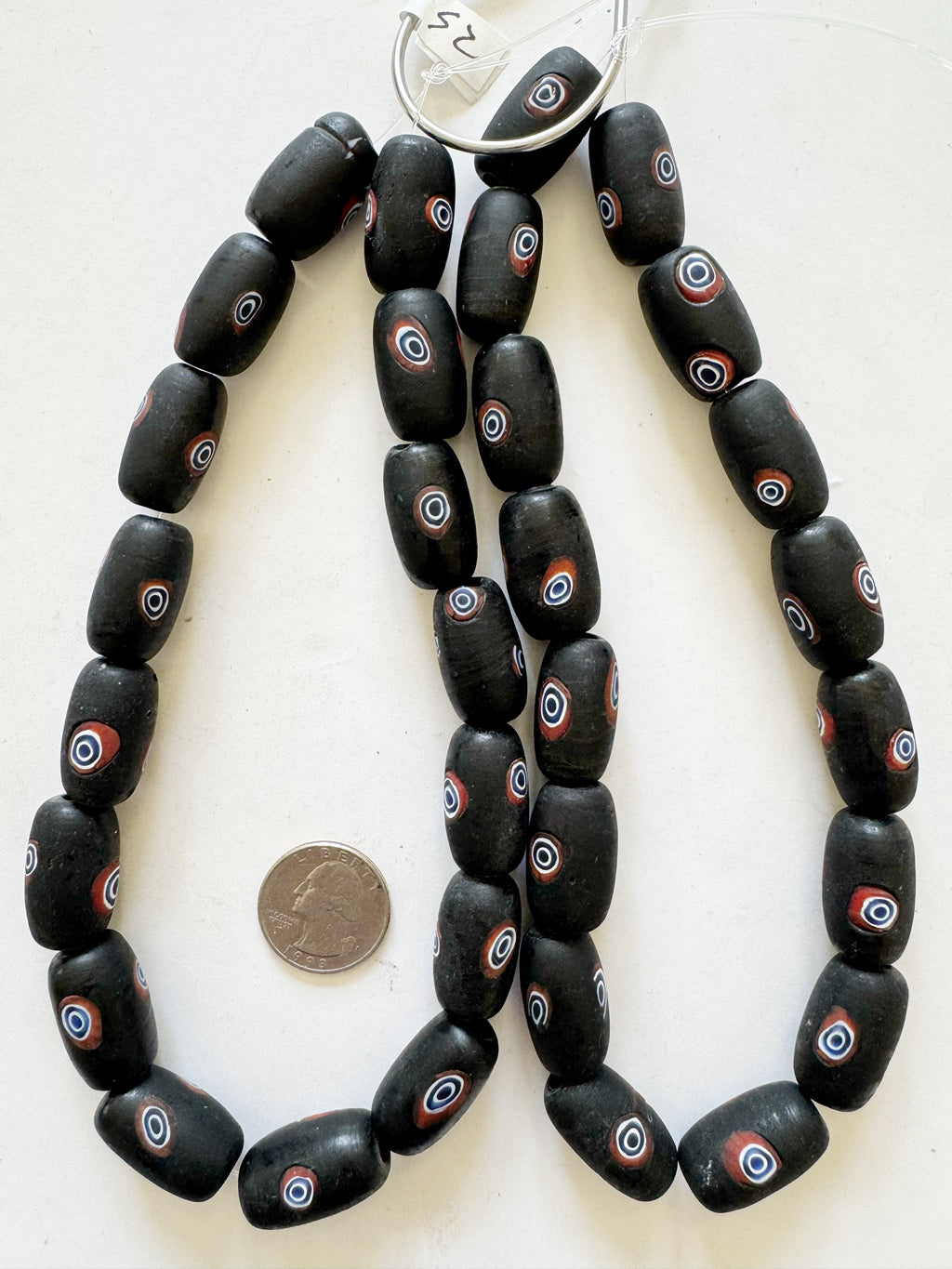 vintage look glass, matte finish, black, red, blue and white, evil eye motif, 25x15mm tube,  sold per 15