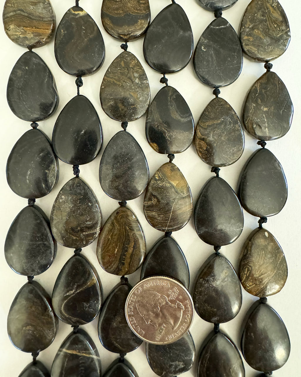 black turritella agate, 25x18x6mm teardrop, 15