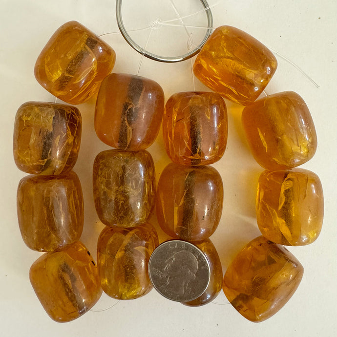 faux crackle amber resin, amber orange, 27-32mm mixed size barrel, 7pc strand, sold per strand