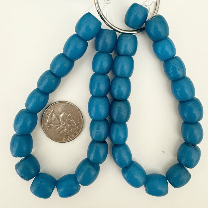 vintage look glass, dark pale blue, 12mm mixed size barrel, 17 piece strand, sold per strand