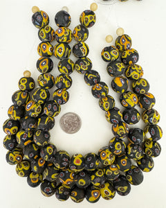 millefiori motif glass, matte black yellow orange white red, 19x17mm mixed size rondelle, 15" strand, sold per strand