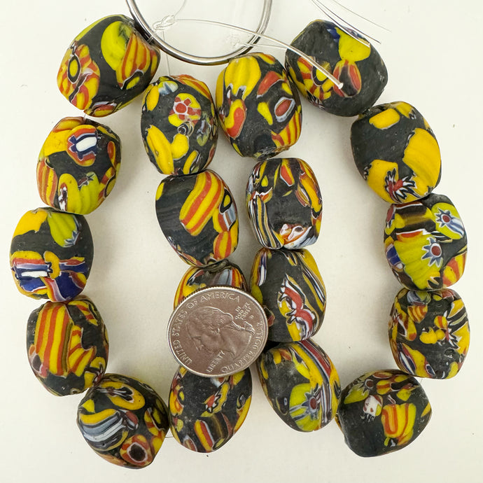 millefiori motif glass, matte black yellow red multi, 23x20mm mixed size barrel, 9 piece strand, sold per strand