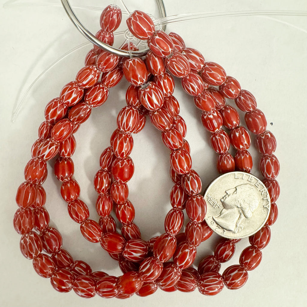 chevron motif glass, red white, 8x7mm mixed size barrel, 26 piece strand, sold per strand