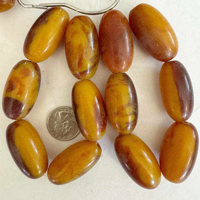 faux amber vintage look resin, yellow orange red swirl, 38x21mm bowed tube, 6pc strand, sold per strand