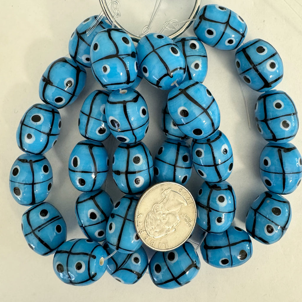 lines dots eyes motif glass, sky blue black white, 20x17mm barrel, 10 piece strand, sold per strand