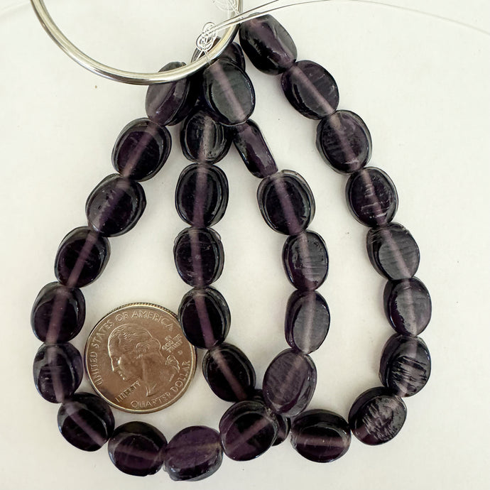 glass, dark translucent purple, 12x10x5mm puff oval, 16 piece strand, sold per strand