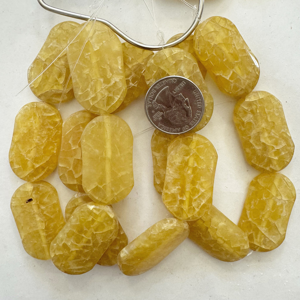 vintage look crackle faux amber resin, translucent pale yellow , 37x21x7mm puff oval, 6pc strand, sold per strand