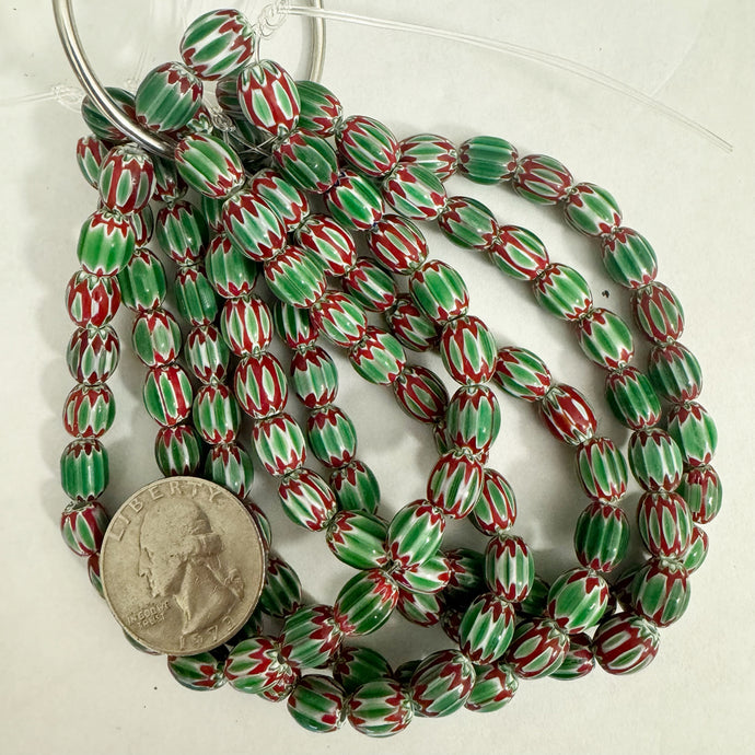 chevron motif glass, green red white, 8x7mm mixed size barrel, 23 piece strand, sold per strand