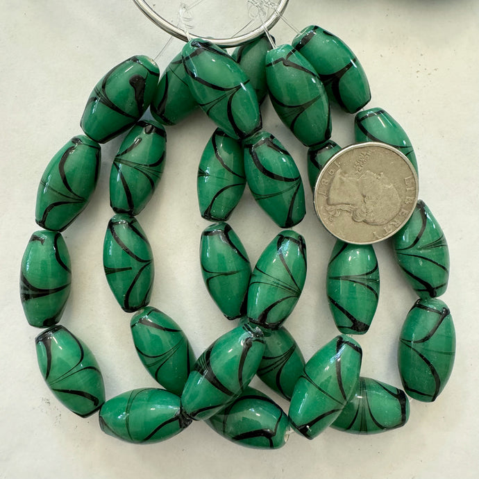 swirling lines motif glass, emerald green black, 24x12mm bowed tube, 9 piece strand, sold per strand