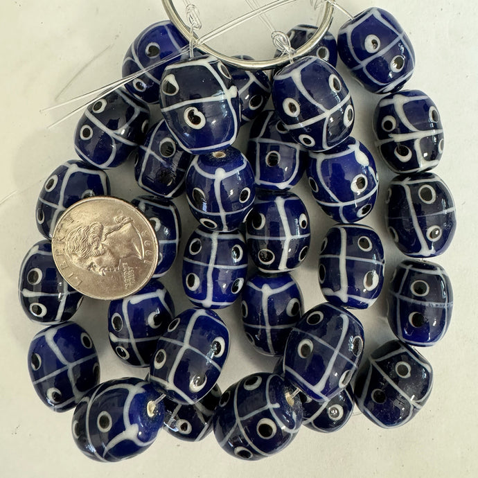 lines dots eyes motif glass, blue black white, 20x17mm barrel, 10 piece strand, sold per strand