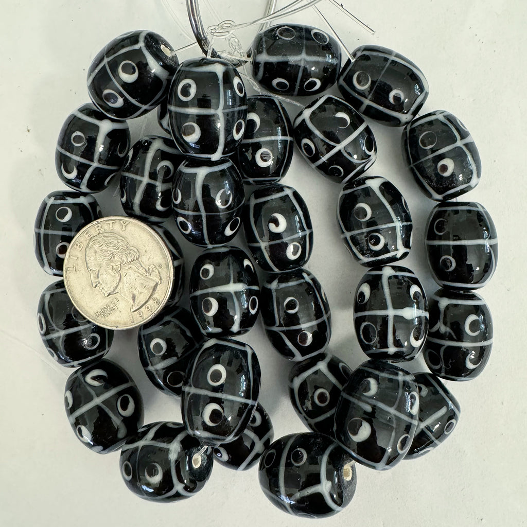 lines dots eyes motif glass, black white, 20x17mm barrel, 10 piece strand, sold per strand