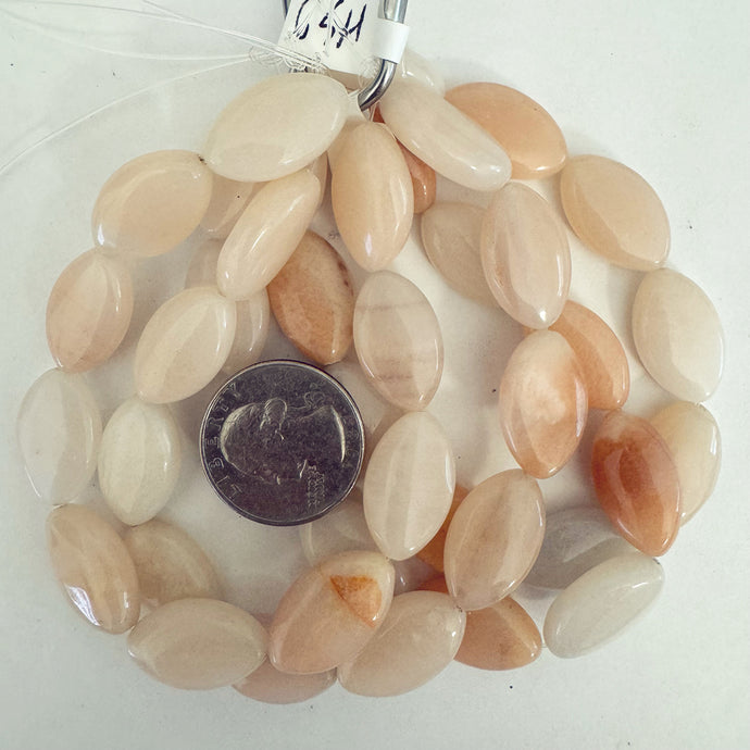 peach jade, 20x12x6mm puff horse eye, 10 piece strand, sold per strand