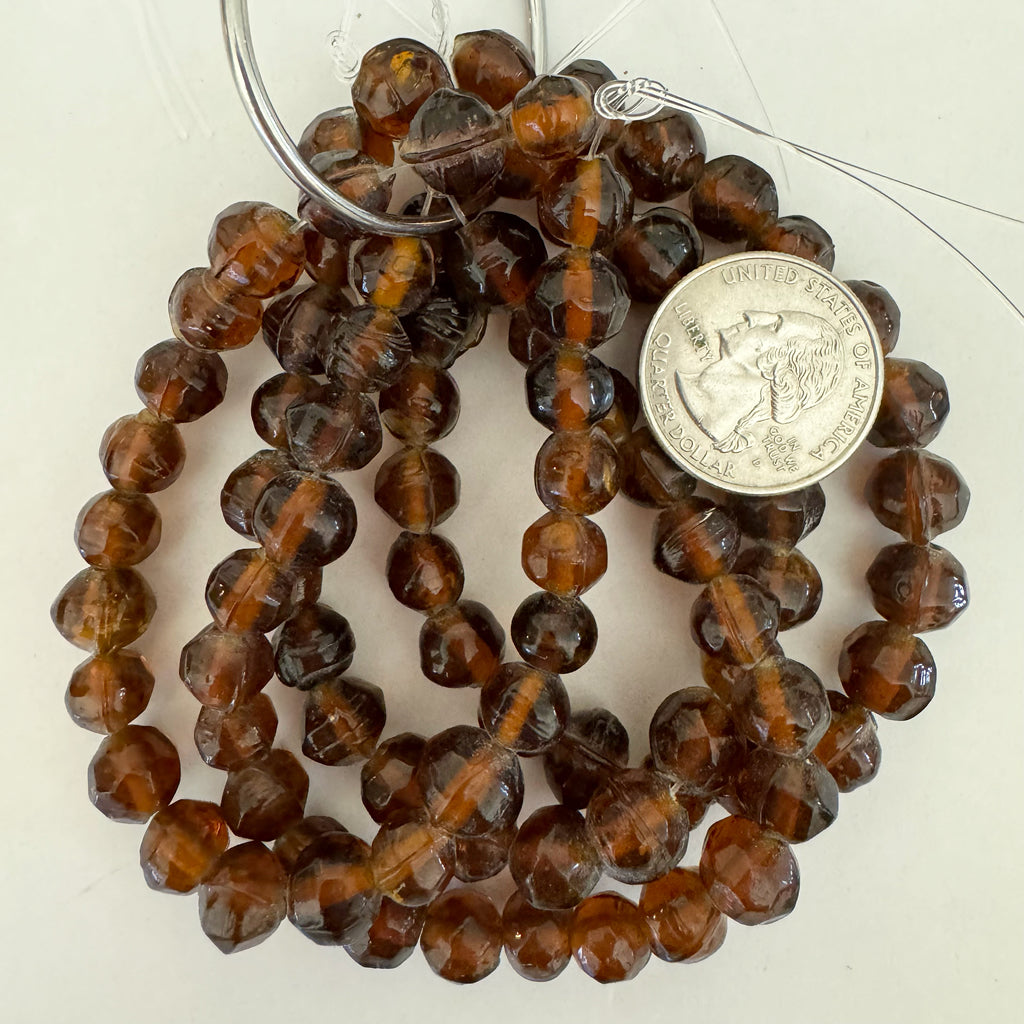 glass, translucent amber brown, 8mm faceted round , 23 piece strand, sold per strand