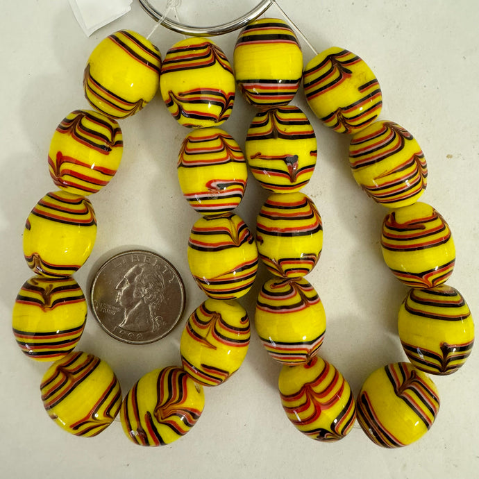 feathered lines motif glass, yellow white black red, 20x17mm barrel, 10 piece strand, sold per strand