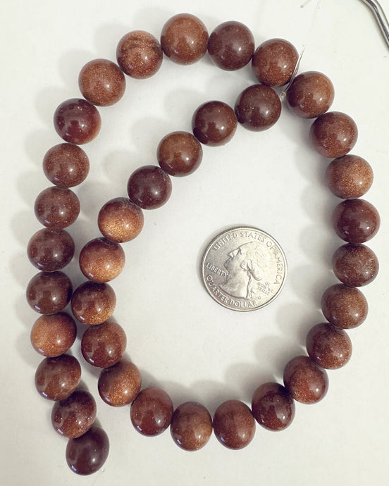 synthetic goldstone, 12mm round, 15