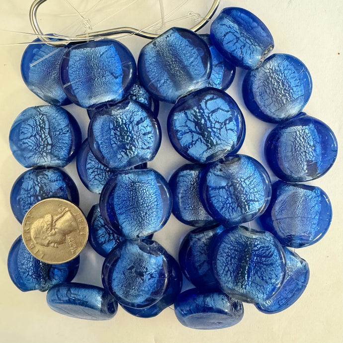 metallic foil inside lined glass, dark periwinkle blue, 27x23x9mm puff coin, 9 piece strand, sold per strand