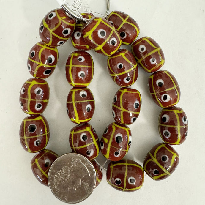 lines dots eyes motif glass, brown yellow black white, 20x17mm barrel, 10 piece strand, sold per strand