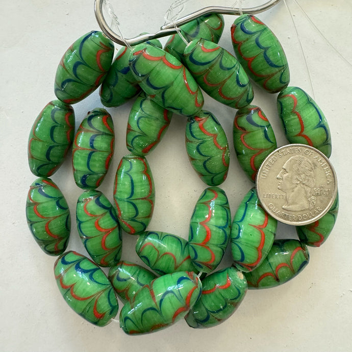 feathered lines motif glass, dark mint green red blue, 21x13mm barrel, 8 piece strand, sold per strand