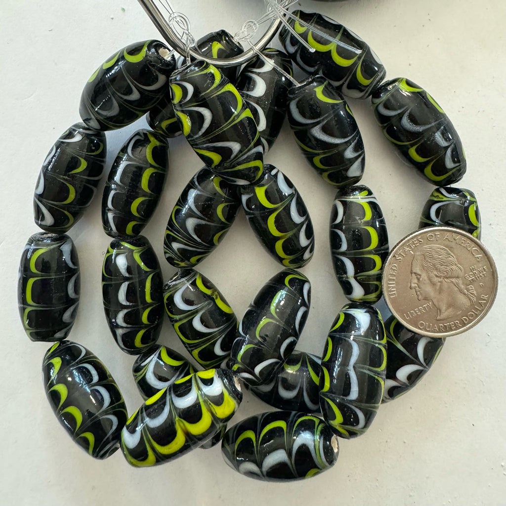 feathered lines motif glass, black yellow white, 21x13mm barrel, 8 piece strand, sold per strand