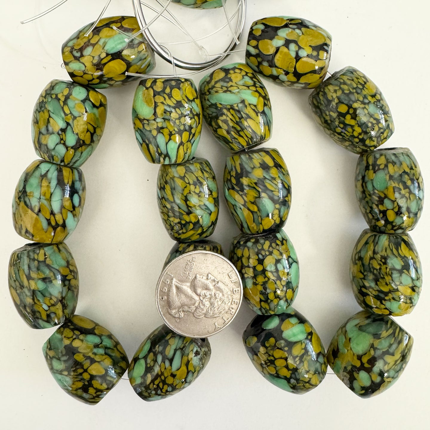 spotted motif glass, black mint green mustard yellow, 23x19mm barrel size mix, 9 piece strand, sold per strand