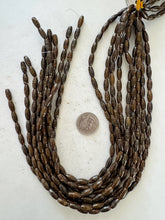 bronzite, 12x5mm bowed rice tube, 15" strand, sold per strand