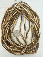 golden brown off white, lines motif, vintage stock bone, 24x6mm bowed tube, 15" strand, sold per strand (batch 1)