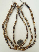 golden brown off white, lines eye motif, vintage stock bone, 24x6mm bowed tube, 15" strand, sold per strand (batch 1)
