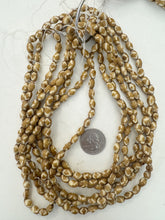 golden brown off white, diamond motif, vintage stock bone, 9x6mm bowed barrel, 15" strand, sold per strand