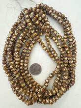 golden brown off white, x dot motif, vintage stock bone, 8x5mm rondelle, 15" strand, sold per strand