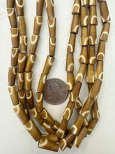 golden brown off white, half circle motif, vintage stock bone, 8x5mm pointed tube, 15" strand, sold per strand